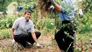 Rahmatullah Hamkar, an Afghan evacuee who was resettled by Gulf Coast JFCS, works in the organization's Refugee Garden on June 1, 2023 in Clearwater, Florida. | Community Garden for Refugees Offers Belonging & a Taste of Home | HIAS